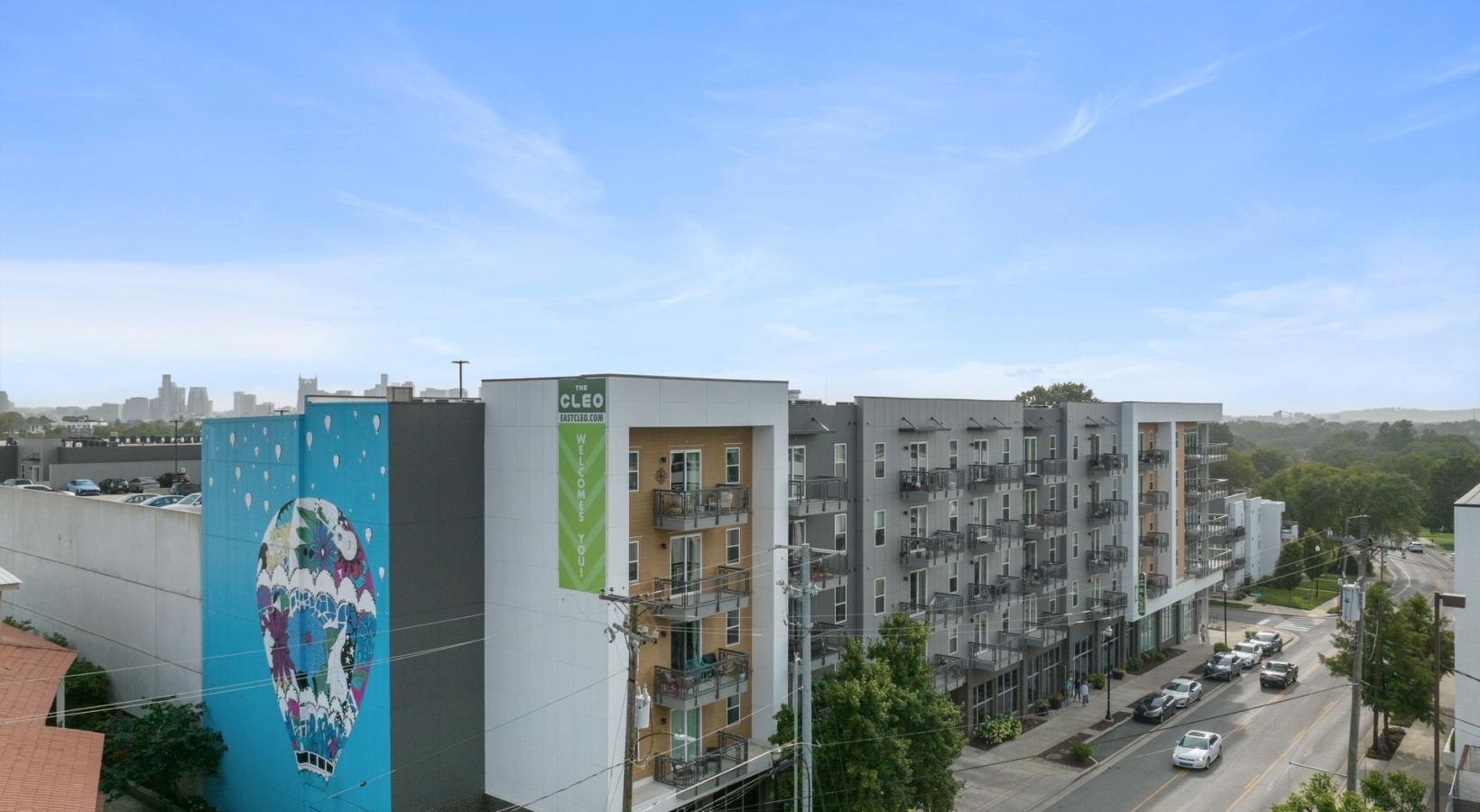 Settle into comfort at The Cleo a large building with a sign on it