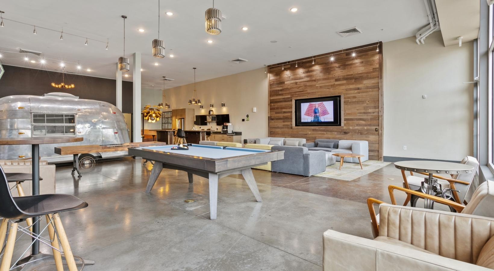 Take advantage of all The Cleo has to offer a room with a pool table and chairs