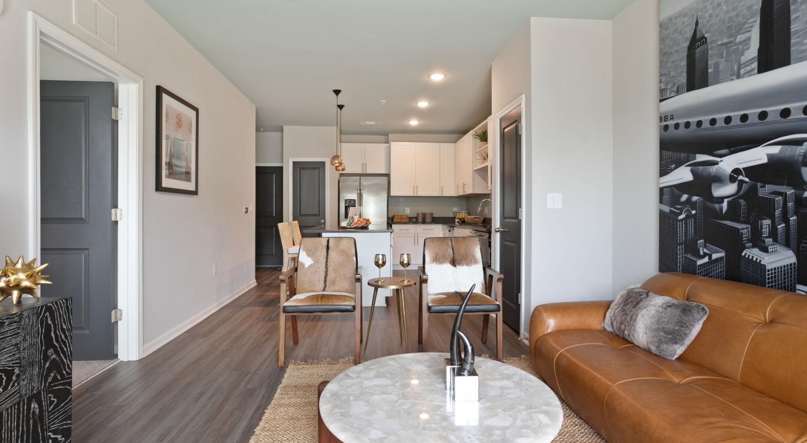 Find your perfect fit at The Cleo a living room with a fireplace