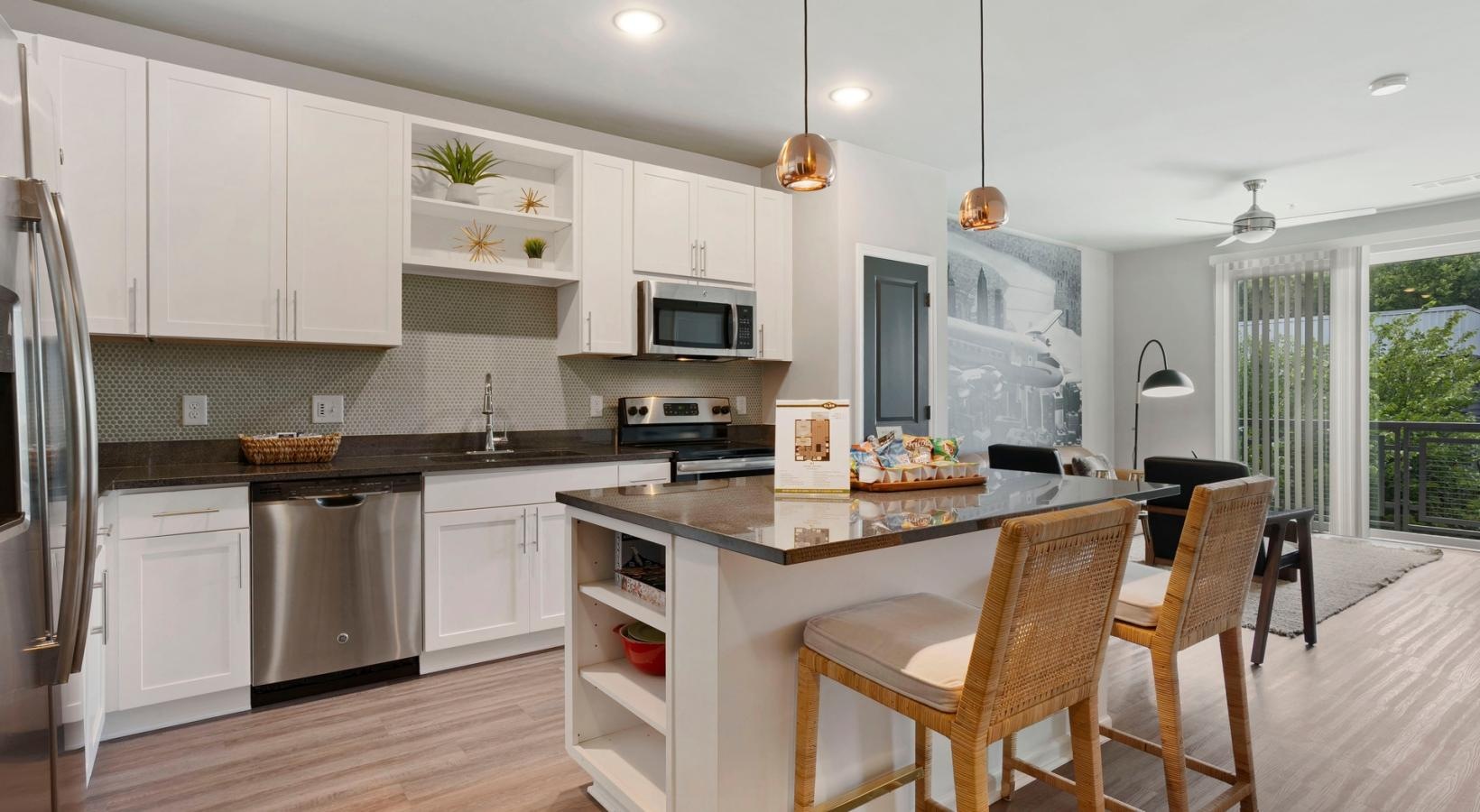 Spacious kitchens with thoughtful details a kitchen with white cabinets
