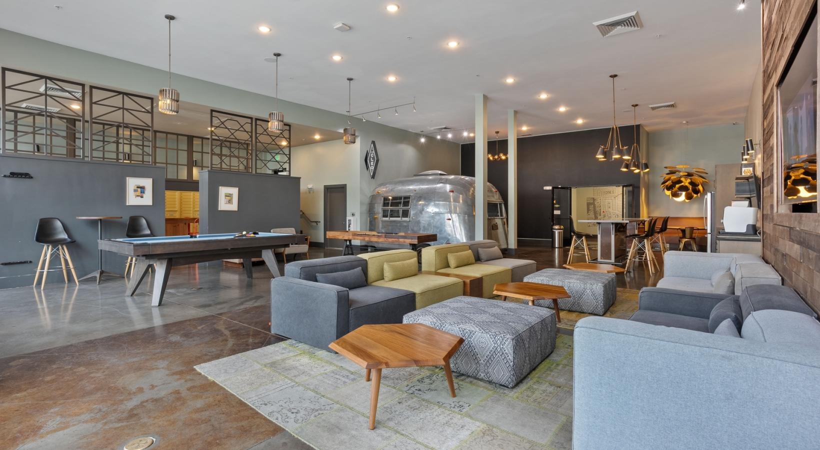 Find your perfect fit at The Cleo a room with a couch and tables