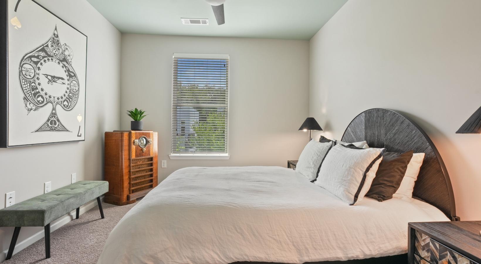 Generous bedroom offerings to fit every family a bedroom with a bed and a table